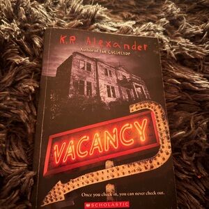 Scholastic Paperback Thriller in Black and Red Cover